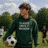 Teenaged boy wearing a “Classy Until Kickoff” hoodie standing on a soccer field during a youth soccer game
