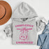This hoodie features a wildly unpredictable cat dangling upside-down from a ceiling fan, perfectly paired with the slogan "Completely Unhinged."