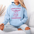 This hoodie features a wildly unpredictable cat dangling upside-down from a ceiling fan, perfectly paired with the slogan "Completely Unhinged."