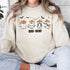 Featuring a posse of cartoon ghosts decked out in cowboy hats, boots, and even a few lasso tricks, this sweatshirt is perfect for haunting the Wild West in style.