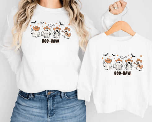 Featuring a posse of cartoon ghosts decked out in cowboy hats, boots, and even a few lasso tricks, this sweatshirt is perfect for haunting the Wild West in style.