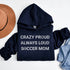 Navy blue hoodie with 'Crazy Proud Always Loud Soccer Mom' text on a white background