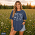 Comfort Colors garment-dyed t-shirt featuring a vintage botanical design with dragonflies, butterflies, bees, wildflowers, dandelions, floating seeds, hearts, stars, and a crescent moon.