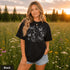 Comfort Colors garment-dyed t-shirt featuring a vintage botanical design with dragonflies, butterflies, bees, wildflowers, dandelions, floating seeds, hearts, stars, and a crescent moon.