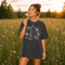 Comfort Colors garment-dyed t-shirt featuring a vintage botanical design with dragonflies, butterflies, bees, wildflowers, dandelions, floating seeds, hearts, stars, and a crescent moon.