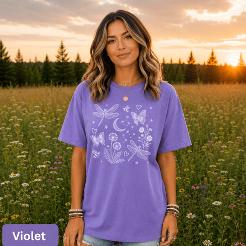 Comfort Colors garment-dyed t-shirt featuring a vintage botanical design with dragonflies, butterflies, bees, wildflowers, dandelions, floating seeds, hearts, stars, and a crescent moon.