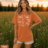 Comfort Colors garment-dyed t-shirt featuring a vintage botanical design with dragonflies, butterflies, bees, wildflowers, dandelions, floating seeds, hearts, stars, and a crescent moon.