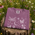Comfort Colors garment-dyed t-shirt featuring a vintage botanical design with dragonflies, butterflies, bees, wildflowers, dandelions, floating seeds, hearts, stars, and a crescent moon.