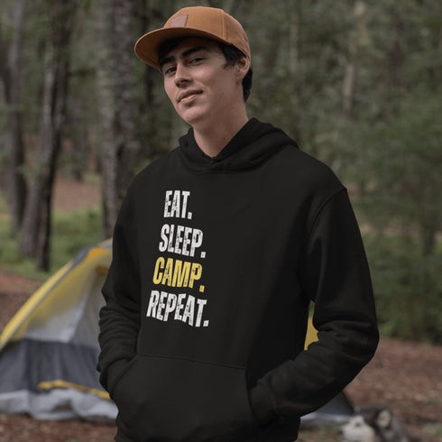 Introducing the ultimate camper's companion: the "Eat. Sleep. Camp. Repeat." Hoodie! This isn't just any ordinary piece of clothing. It's your best friend in the wilderness, your cozy confidante under the stars, and quite possibly the most honest representation of your weekend plans.