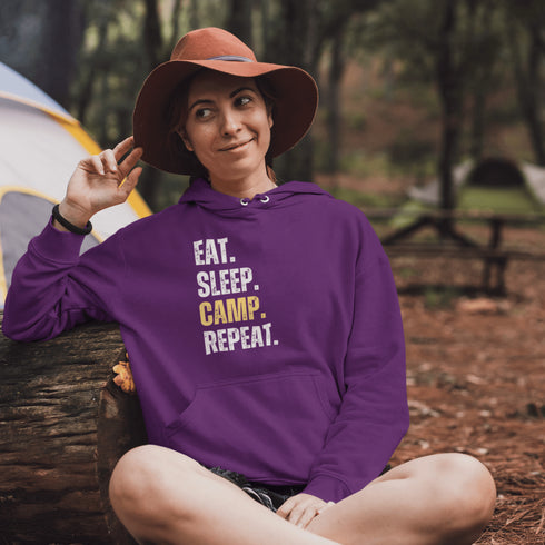 Introducing the ultimate camper's companion: the "Eat. Sleep. Camp. Repeat." Hoodie! This isn't just any ordinary piece of clothing. It's your best friend in the wilderness, your cozy confidante under the stars, and quite possibly the most honest representation of your weekend plans.