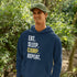 Introducing the ultimate camper's companion: the "Eat. Sleep. Camp. Repeat." Hoodie! This isn't just any ordinary piece of clothing. It's your best friend in the wilderness, your cozy confidante under the stars, and quite possibly the most honest representation of your weekend plans.