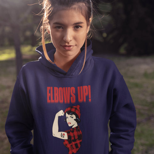 Meet the ultimate symbol of Canadian pride—a tough, toque-wearing, plaid-rocking legend flexing her muscle, because nothing says "I'm from the Great White North" like strength and style