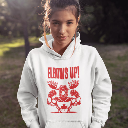Get ready to hit the ice (or the couch) in style with our "Elbows Up!" hoodie! Featuring a tough-as-nails moose rocking a Canada hockey shirt and helmet while flexing its muscles