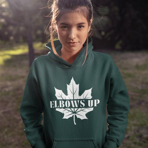 Featuring a bold maple leaf and the iconic "Elbows Up" phrase, this hoodie lets everyone know you’re not afraid to play hard—on the ice, in life