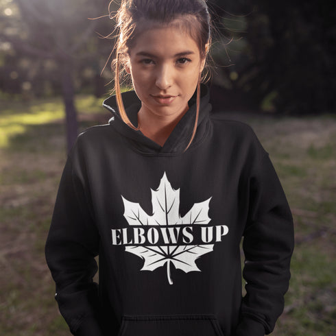 Featuring a bold maple leaf and the iconic "Elbows Up" phrase, this hoodie lets everyone know you’re not afraid to play hard—on the ice, in life