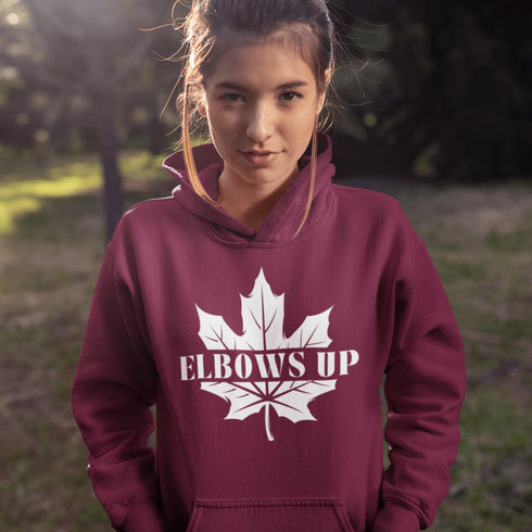Featuring a bold maple leaf and the iconic "Elbows Up" phrase, this hoodie lets everyone know you’re not afraid to play hard—on the ice, in life