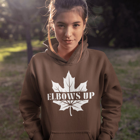 Featuring a bold maple leaf and the iconic "Elbows Up" phrase, this hoodie lets everyone know you’re not afraid to play hard—on the ice, in life