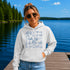 Customizable Lake Life hoodie featuring lake-themed illustrations including a dock, canoe, sailboat, campfire, fishing gear, and personalized lake name design on a unisex Gildan 18500 hoodie available in multiple colors.