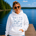 Customizable Lake Life hoodie featuring lake-themed illustrations including a dock, canoe, sailboat, campfire, fishing gear, and personalized lake name design on a unisex Gildan 18500 hoodie available in multiple colors.