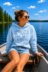 Customizable Lake Life hoodie featuring lake-themed illustrations including a dock, canoe, sailboat, campfire, fishing gear, and personalized lake name design on a unisex Gildan 18500 hoodie available in multiple colors.