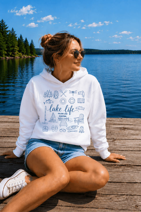 Customizable Lake Life hoodie featuring lake-themed illustrations including a dock, canoe, sailboat, campfire, fishing gear, and personalized lake name design on a unisex Gildan 18500 hoodie available in multiple colors.