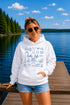 Customizable Lake Life hoodie featuring lake-themed illustrations including a dock, canoe, sailboat, campfire, fishing gear, and personalized lake name design on a unisex Gildan 18500 hoodie available in multiple colors.