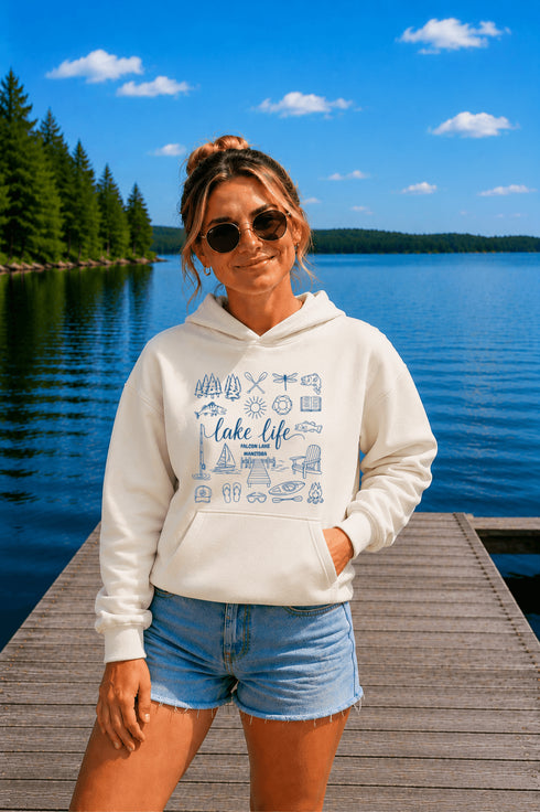 Customizable Lake Life hoodie featuring lake-themed illustrations including a dock, canoe, sailboat, campfire, fishing gear, and personalized lake name design on a unisex Gildan 18500 hoodie available in multiple colors.