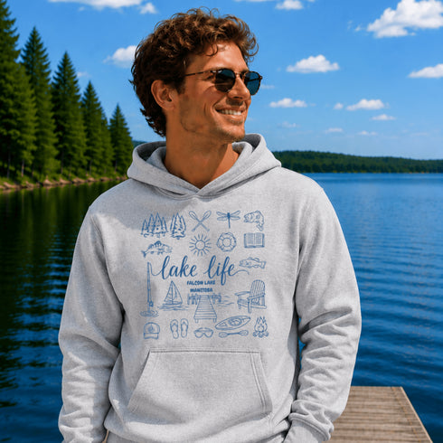 Customizable Lake Life hoodie featuring lake-themed illustrations including a dock, canoe, sailboat, campfire, fishing gear, and personalized lake name design on a unisex Gildan 18500 hoodie available in multiple colors.