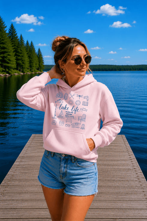 Customizable Lake Life hoodie featuring lake-themed illustrations including a dock, canoe, sailboat, campfire, fishing gear, and personalized lake name design on a unisex Gildan 18500 hoodie available in multiple colors.