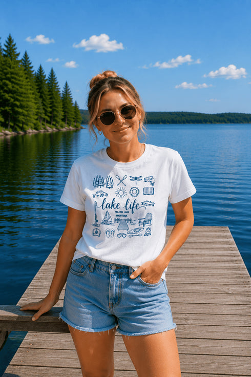 Woman wearing a 'Lake Life' t-shirt on a dock by a lake
