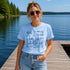 Woman wearing a 'Lake Life' t-shirt by a lake