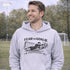 man wearing grey hoodie with “Fear The Goalie” soccer goalkeeper design featuring diving goalie making a save
