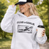 woman wearing grey hoodie with “Fear The Goalie” soccer goalkeeper design featuring diving goalie making a save
