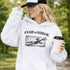 woman wearing grey hoodie with “Fear The Goalie” soccer goalkeeper design featuring diving goalie making a save