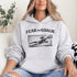 woman wearing grey hoodie with “Fear The Goalie” soccer goalkeeper design featuring diving goalie making a save