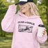 woman wearing grey hoodie with “Fear The Goalie” soccer goalkeeper design featuring diving goalie making a save