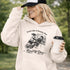 funny hockey hoodie with feels like a penalty box kind of day design featuring players crashing into boards on light tan hoodie