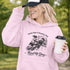 funny hockey hoodie with feels like a penalty box kind of day design featuring players crashing into boards on light pink hoodie