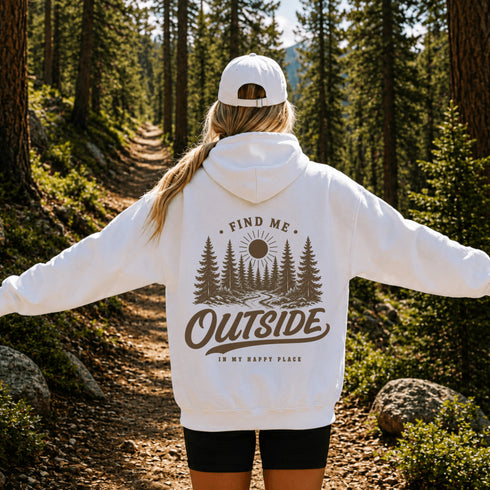 Vintage outdoor-inspired hoodie featuring a small left chest graphic and large nature-themed back design, shown in a lifestyle mockup. Available in multiple colors.