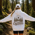 Vintage outdoor-inspired hoodie featuring a small left chest graphic and large nature-themed back design, shown in a lifestyle mockup. Available in multiple colors.