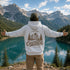 Vintage outdoor graphic hoodie featuring a small left chest design and a large mountain landscape graphic on the back, available in multiple colors and shown in various lifestyle and product mockups.