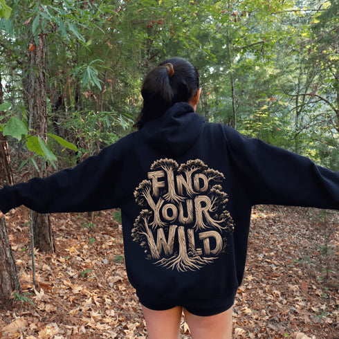 Featuring the bold phrase "Find Your Wild" crafted in a unique tree branch letter font, this hoodie is a celebration of the untamed beauty of the forest and the freedom it inspires.