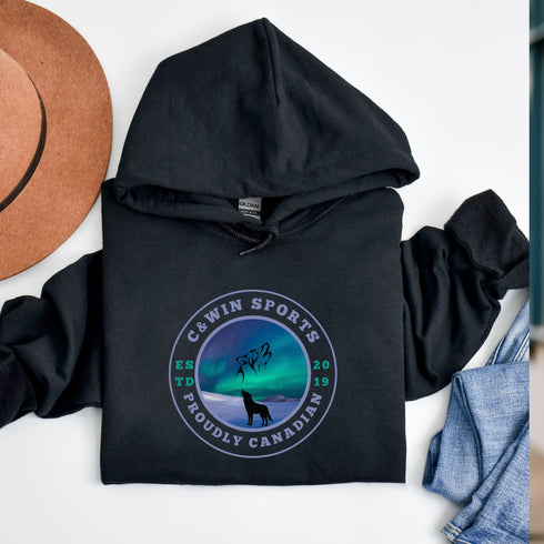 This unique hoodie features a mesmerizing graphic of the aurora borealis dancing across the night sky, with a majestic wolf howling at the moon, creating a sense of mystery and wonder.