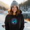 This unique hoodie features a mesmerizing graphic of the aurora borealis dancing across the night sky, with a majestic wolf howling at the moon, creating a sense of mystery and wonder.
