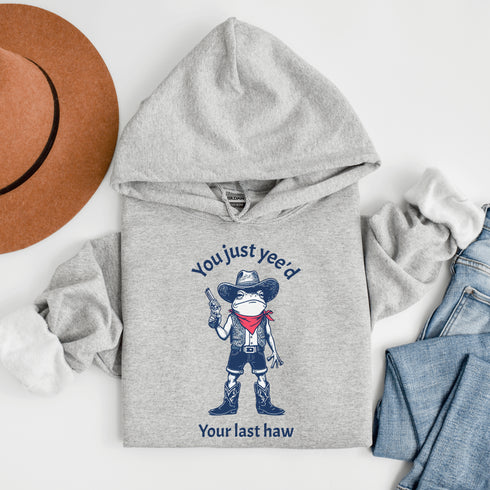 Y’all better watch out—this frog means business. Rocking a cowboy hat, boots, and a pistol, this amphibian outlaw isn’t here for small talk.