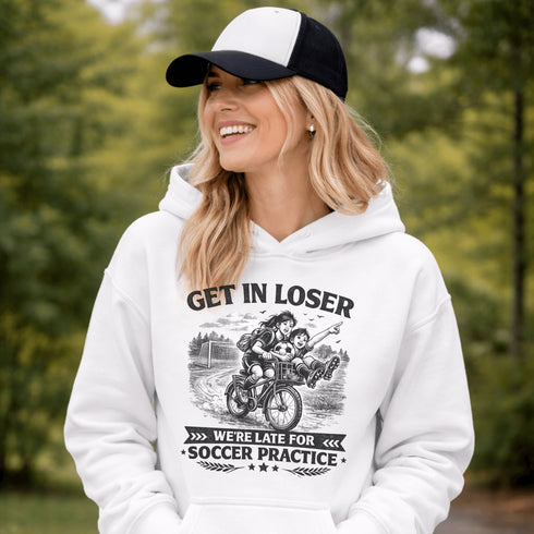 Funny soccer hoodie design showing two kids riding a bike to soccer practice with the phrase get in loser we’re late for soccer practice