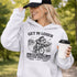 Funny soccer hoodie design showing two kids riding a bike to soccer practice with the phrase get in loser we’re late for soccer practice