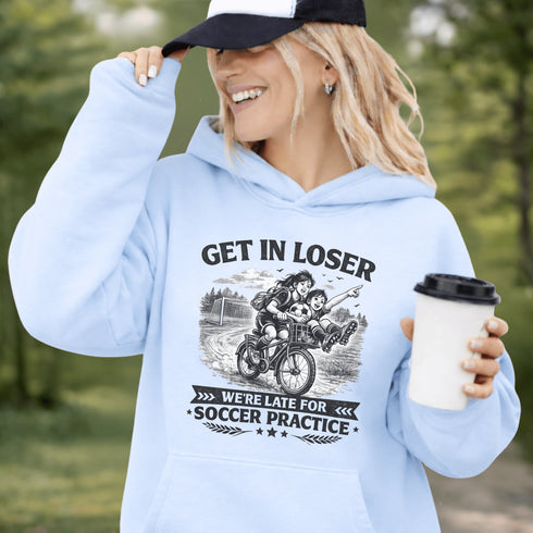 Funny soccer hoodie design showing two kids riding a bike to soccer practice with the phrase get in loser we’re late for soccer practice