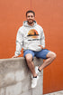 Featuring a sunset backdrop over the charming town of Gimli, Manitoba, with the iconic Viking statue front and center, this hoodie is your stylish ticket to Viking vibes without having to set sail.