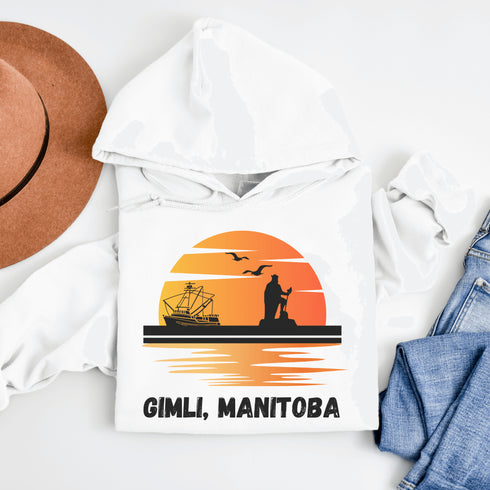 Featuring a sunset backdrop over the charming town of Gimli, Manitoba, with the iconic Viking statue front and center, this hoodie is your stylish ticket to Viking vibes without having to set sail.
